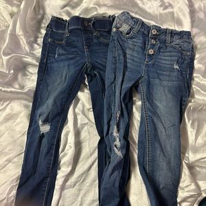 2 pairs of girls jeans.